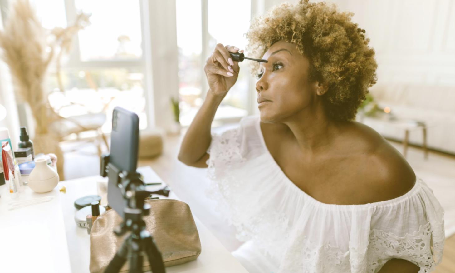 Fashion design workshop with students examining fabric samples and discussing textile choices